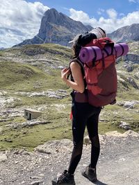 Rear view of man standing on mountain