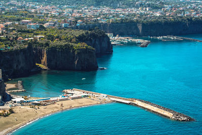 High angle view of city by sea