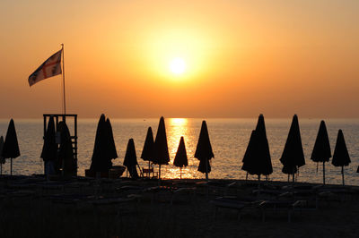 Silhouette of beach umbrellas on beach