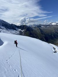 Low angle view of snow covered mountain against sky