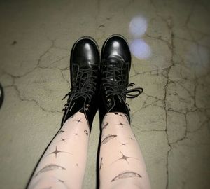 Low section of woman wearing shoes