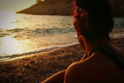 People relaxing on beach