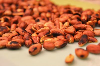 Close-up of roasted peanuts on table