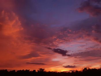 Low angle view of dramatic sky during sunset