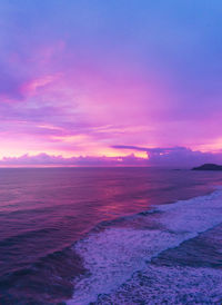 Scenic view of sea against romantic sky at sunset