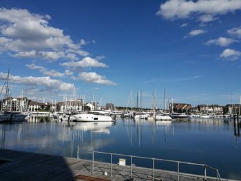 Boats moored at harbor