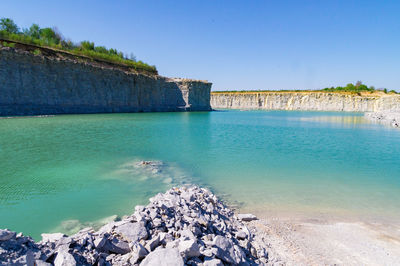 Scenic view of sea against clear blue sky