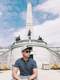 Mid adult man wearing sunglasses against sky