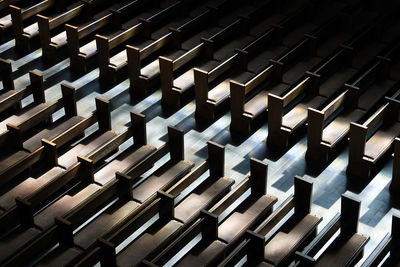 High angle view of empty benches in church