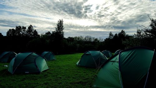 Tent on field against sky