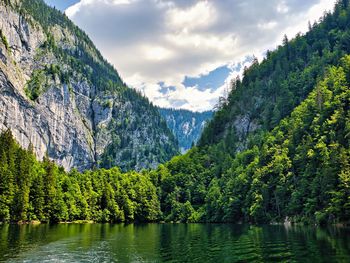 Scenic view of lake and mountains against sky