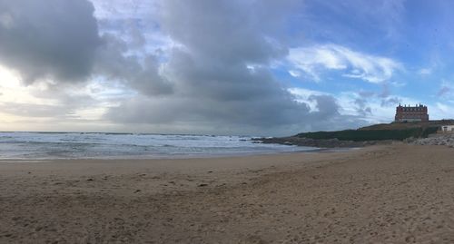 Scenic view of beach against sky