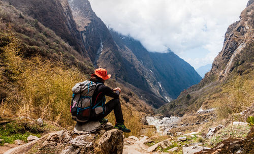 Man with umbrella on mountains
