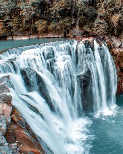 View of waterfall in forest