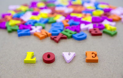 Close-up of colorful love text on table