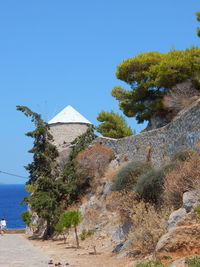 Surrounding wall at beach against sky