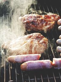 Close-up of meat on barbecue grill