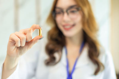 Portrait of woman holding hands