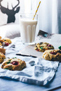 Close-up of cookies and milk on table