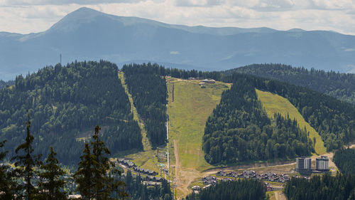 High angle view of trees and mountains against sky