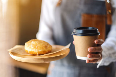 Cropped image of person having breakfast