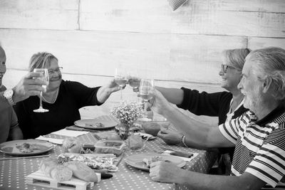 Happy family toasting drink at home