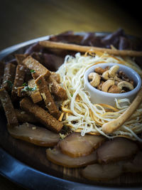 High angle close-up of various food served in plate on table