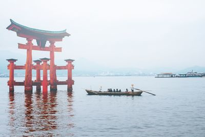 Boat in sea against clear sky