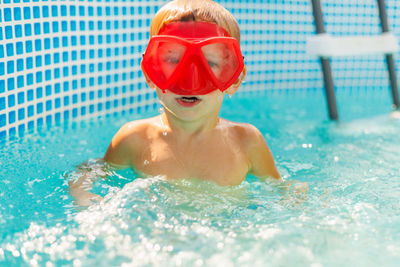 Portrait of woman swimming in pool