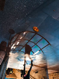 Low angle view of woman standing at night