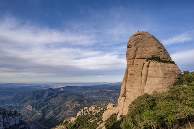 Scenic view of rock formations against sky