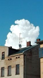 Low angle view of building against blue sky