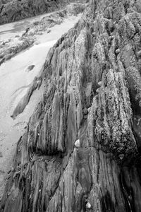 Water flowing through rock formations on beach