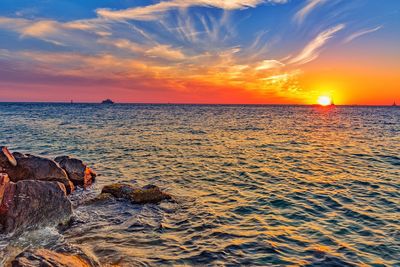 Scenic view of sea against sky during sunset