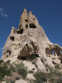 Low angle view of rock formation against clear sky at cappadocia