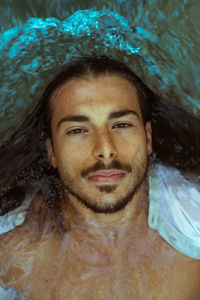 High angle portrait of man swimming in lake