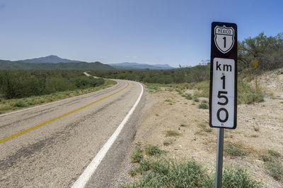 Close-up of road signs on countryside landscape