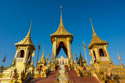 Low angle view of temple against clear blue sky