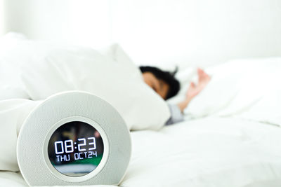 Close-up of woman sleeping on bed