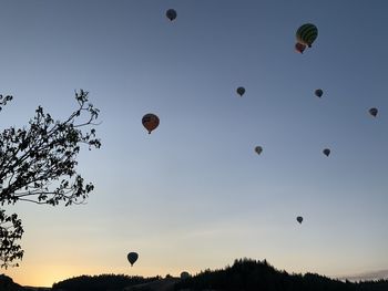 Low angle view of hot air balloons against sky in pamukkale