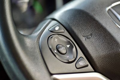 Close-up of buttons on steering wheel