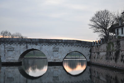 Bridge over river against sky