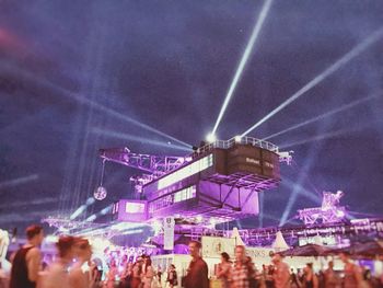 People enjoying music concert at night