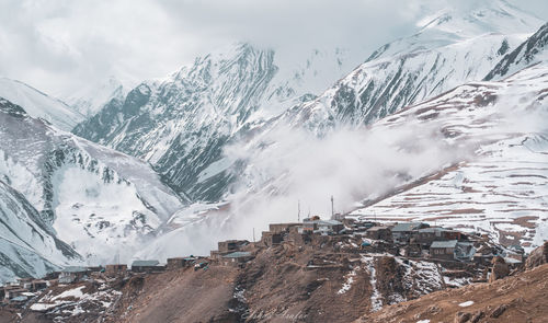 Panoramic view of snowcapped mountains against sky