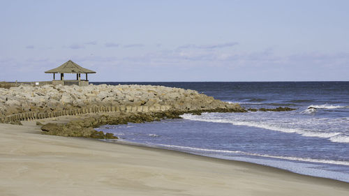 Scenic view of beach against sky