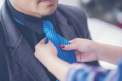 Close-up of man holding hands