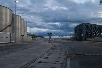 Road by city against sky