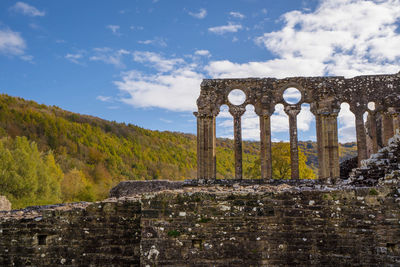 Old ruin building against cloudy sky