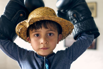 Portrait of cute boy wearing hat