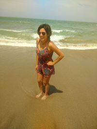 Full length of a smiling girl on beach